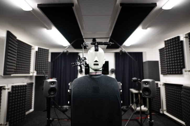 Mannequin head in an anechoic chamber for audio testing